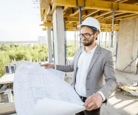 Town planner reviewing development plans